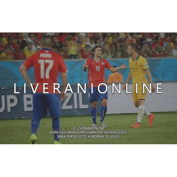 (140613) -- CUIABA, June 13, 2014 () -- Chile\'s Jorge Valdivia (C) reacts during a Group B match between Chile and Australia of 2014 FIFA World Cup in the Arena Pantanal Stadium in Cuiaba, Brazil, June 13, 2014. (/Li Ming)(rh) ©photoshot/Agenzia Aldo Liverani sas - ITALY ONLY - EDITORIAL USE ONLY - Cile v Australia partita del Gruppo B Coppa del mondo FIFA World Cup nel Pantanal stadio Arena di Cuiaba, Brasile, 13 giugno 2014
