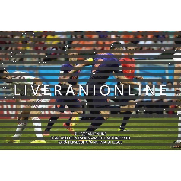 #9, Van Persie and #10, Sneijder, from Netherlands, and #16 Sergio Busquets, from Spain, in the #3 match of the 2014 World Cup, in Salvador, Brasil (Photo by Gustavo Basso/NurPhoto) ©photoshot/Agenzia Aldo Liverani sas - ITALY ONLY - EDITORIAL USE ONLY - Spagna Vs Olanda partita del Gruppo B Coppa del Mondo FIFA 2014 in Salvador, in Brasile, 13 giugno 2014