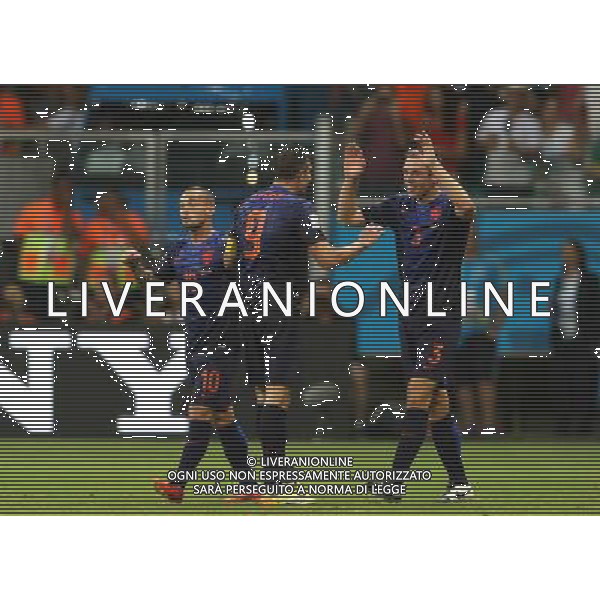 (140613) -- SALVADOR, June 13, 2014 () -- Netherlands\' Stefan de Vrij (R) celebrates for his goal with his teammate Robin van Persie (C) at the Arena Fonte Nova Stadium during a Group B match between Spain and Netherlands of 2014 FIFA World Cup in Salvador, Brazil, June 13, 2014. (/Cao Can) ©photoshot/Agenzia Aldo Liverani sas - ITALY ONLY - EDITORIAL USE ONLY - Spagna Vs Olanda partita del Gruppo B Coppa del Mondo FIFA 2014 in Salvador, in Brasile, 13 giugno 2014