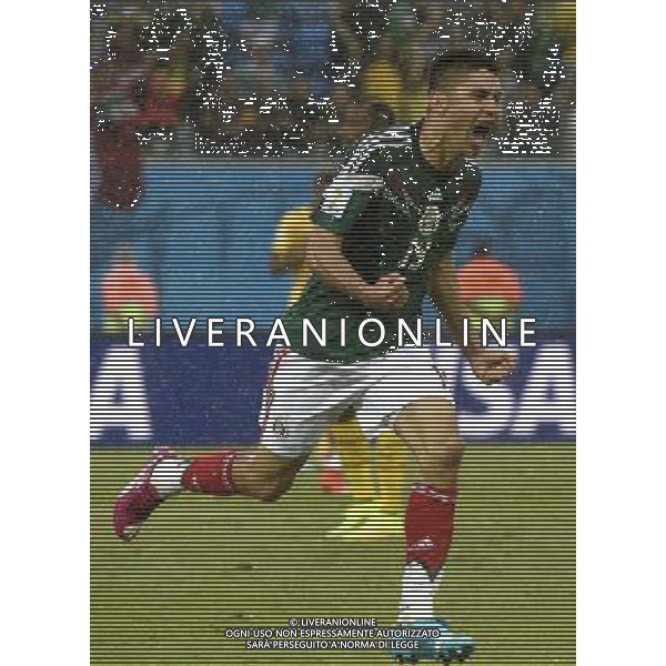 (140613) -- NATAL, June 13, 2014 () -- Mexico\'s Oribe Peralta celebrates his goal during a Group A match between Mexico and Cameroon of 2014 FIFA World Cup in the Estadio das Dunas Stadium in NATAL, Brazil, June 13, 2014. (/Lui Siuwai)(rh) ©photoshot/Agenzia Aldo Liverani sas - ITALY ONLY - EDITORIAL USE ONLY - Messico v Camerun partita del Gruppo A Coppa del Mondo FIFA 2014 in Estadio das Dunas Stadium a Natal, Brasile, 13 giugno 2014