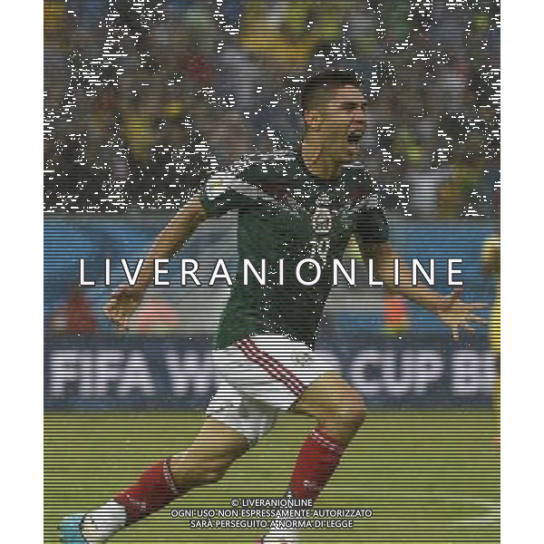 (140613) -- NATAL, June 13, 2014 () -- Mexico\'s Oribe Peralta celebrates his goal during a Group A match between Mexico and Cameroon of 2014 FIFA World Cup in the Estadio das Dunas Stadium in NATAL, Brazil, June 13, 2014. (/Lui Siuwai)(rh) ©photoshot/Agenzia Aldo Liverani sas - ITALY ONLY - EDITORIAL USE ONLY - Messico v Camerun partita del Gruppo A Coppa del Mondo FIFA 2014 in Estadio das Dunas Stadium a Natal, Brasile, 13 giugno 2014