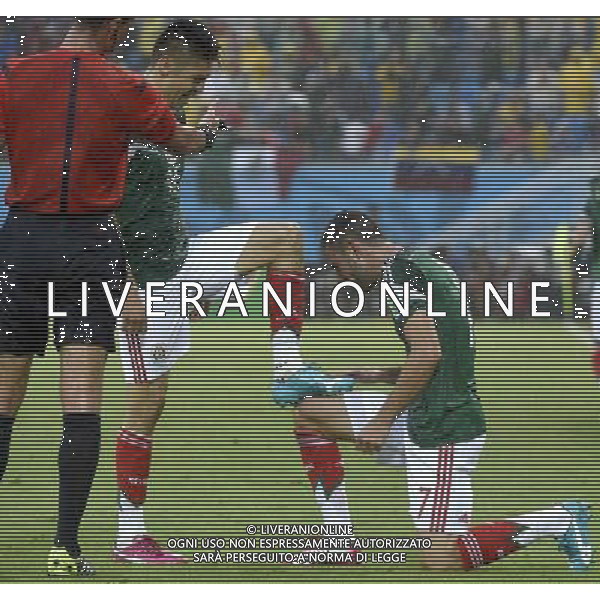 (140613) -- NATAL, June 13, 2014 () -- Mexico\'s Miguel Layun (R) and Oribe Peralta (C) celebrate the goal during a Group A match between Mexico and Cameroon of 2014 FIFA World Cup in the Estadio das Dunas Stadium in NATAL, Brazil, June 13, 2014. Mexico won 1-0 over Cameroon on Friday.(/Lui Siu Wai)(rh) ©photoshot/Agenzia Aldo Liverani sas - ITALY ONLY - EDITORIAL USE ONLY - Messico v Camerun partita del Gruppo A Coppa del Mondo FIFA 2014 in Estadio das Dunas Stadium a Natal, Brasile, 13 giugno 2014