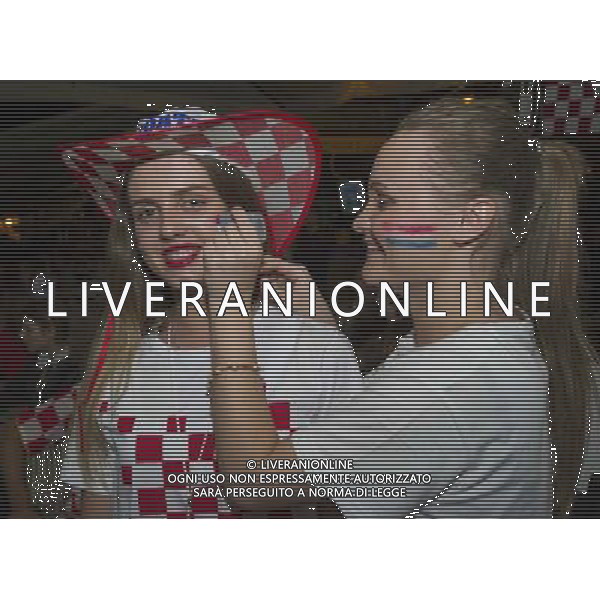 (140613) -- ZAGREB, June 13, 2014 () -- Croatian soccer fans prepare for a match between Croatia and Brazil, in Zagreb, Croatia, June 12, 2014. Thousands of fans on Thursday watched the FIFA World Cup opening match on a big screen at Zagreb\'s central square. (/Miso Lisanin) ©photoshot/Agenzia Aldo Liverani sas - ITALY ONLY - EDITORIAL USE ONLY - L\'esultanza dei tifosi per la partita di apertura tra Brasile e Croazia Coppa del Mondo FIFA WORLD CUP BRASILE 12 giugno 2014