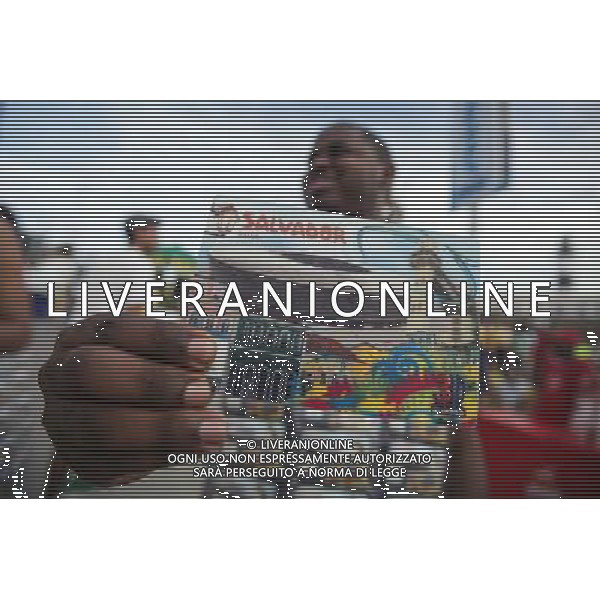 (140612) -- SALVADOR, June 12, 2014 () -- A Brazilian vendor showcases a 3-D postcard as fans watch the opening match between Brazil and Croatia of 2014 FIFA World Cup at the Farol da Barra in Salvador, Bahia, Brazil,on June 12, 2014. Brazil won 3-1 over Croatia on Thursday. (/Jhon Paz) ©photoshot/Agenzia Aldo Liverani sas - ITALY ONLY - EDITORIAL USE ONLY - L\'esultanza dei tifosi per la partita di apertura tra Brasile e Croazia Coppa del Mondo FIFA WORLD CUP BRASILE 12 giugno 2014