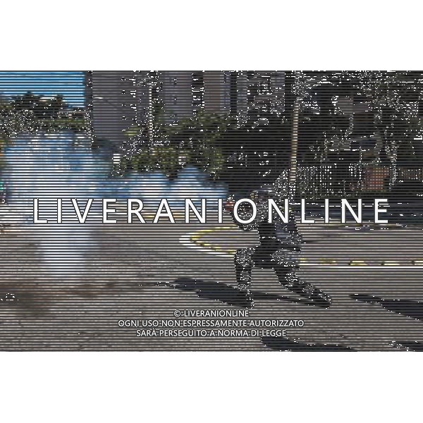 Riot police shoot tear gas during demonstration of social movements and groups against the World Cup on June 12, 2014 in Sao Paulo, Brazil. Clashes occurred on the Radial Leste Avenue, a few kilometers from the Itaquerão stadium, where it occurs today the opening match of the World Cup between Brazil and Croatia. (Photo by Tiago Mazza Chiaravalloti/NurPhoto) ©photoshot/Agenzia Aldo Liverani sas - ITALY ONLY - EDITORIAL USE ONLY - Scontri tra manifestanti e polizia durante la manifestazione di Protesta e la dimostrazione dei movimenti sociali a Sao Paulo, in Brasile il 12 giugno 2014 nel giorno della partita inaugurale della Coppa del Mondo Fifa World Cup 