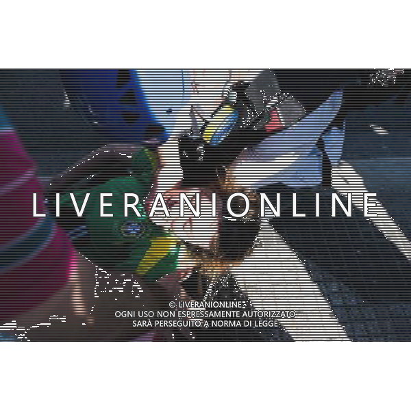 Woman pass out because of tear gas effects during a demonstration of social movements and groups against the World Cup on June 12, 2014 in Sao Paulo, Brazil. Clashes occurred on the Radial Leste Avenue, a few kilometers from the Itaquerão stadium, where it occurs today the opening match of the World Cup between Brazil and Croatia. (Photo by Tiago Mazza Chiaravalloti/NurPhoto) ©photoshot/Agenzia Aldo Liverani sas - ITALY ONLY - EDITORIAL USE ONLY - Scontri tra manifestanti e polizia durante la manifestazione di Protesta e la dimostrazione dei movimenti sociali a Sao Paulo, in Brasile il 12 giugno 2014 nel giorno della partita inaugurale della Coppa del Mondo Fifa World Cup 