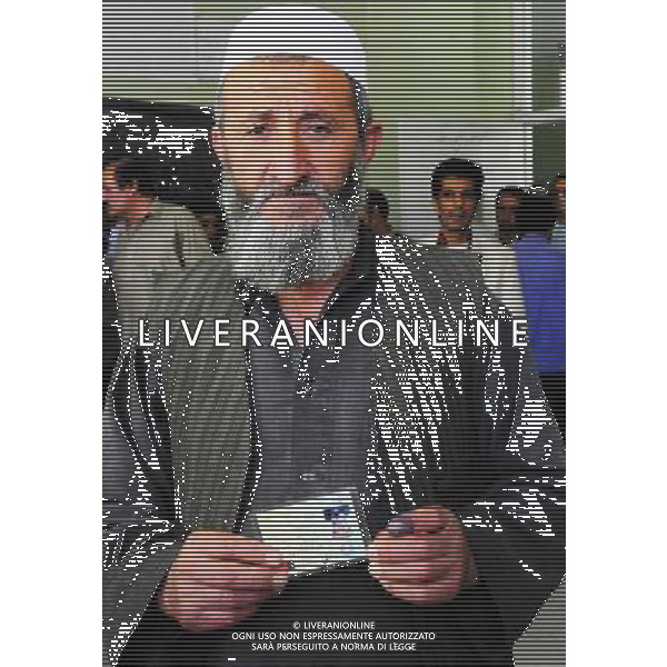 (140614) -- KABUL, June 14, 2014 (Xinhua) -- An Afghan man shows his identity card at a polling center in Kabul, Afghanistan, on June 14, 2014. Voting for the country\'s next president began on Saturday morning and the final results will be announced on July 22. (Xinhua/Omid) ****Authorized by ytfs**** ©PHOTOSHOT/Agenzia Aldo Liverani Sas - ITALY ONLY - EDITORIAL USE ONLY - Votazione per il ballottaggio delle elezioni presidenziali in un centro elettorale a Kabul, in Afghanistan, il 14 giugno, 2014