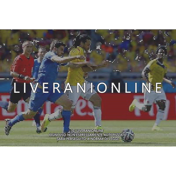 (140614) -- BELO HORIZONTE, June 14, 2014 () -- Greece\'s Sokratis Papastathopoulos (L, front) strives for the ball with Colombia\'s Mario Yepes during a Group C match between Colombia and Greece of 2014 FIFA World Cup at the Estadio Mineirao Stadium in Belo Horizonte, Brazil, June 14, 2014. (/Liu Bin)(pcy) ©PHOTOSHOT/Agenzia Aldo Liverani Sas - ITALY ONLY - EDITORIAL USE ONLY - Colombia Vs Grecia partita del Gruppo C Coppa del Mondo FIFA 2014 Mineirao stadio Estadio a Belo Horizonte, in Brasile 14 Giugno 2014