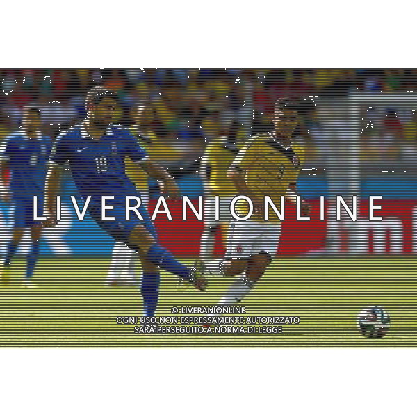 (140614) -- BELO HORIZONTE, June 14, 2014 () -- Greece\'s Sokratis Papastathopoulos (L) passes the ball during a Group C match between Colombia and Greece of 2014 FIFA World Cup at the Estadio Mineirao Stadium in Belo Horizonte, Brazil, June 14, 2014. (/Liu Bin)(pcy) ©PHOTOSHOT/Agenzia Aldo Liverani Sas - ITALY ONLY - EDITORIAL USE ONLY - Colombia Vs Grecia partita del Gruppo C Coppa del Mondo FIFA 2014 Mineirao stadio Estadio a Belo Horizonte, in Brasile 14 Giugno 2014