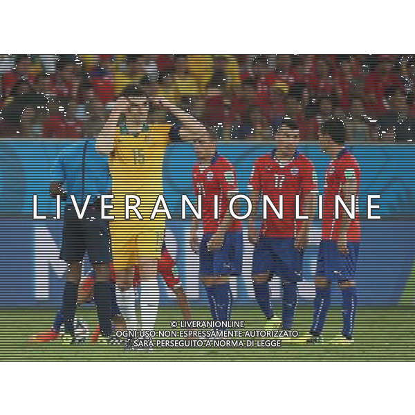 (140613) -- CUIABA, June 13, 2014 () -- Australia\'s Mile Jedinak gets a yellow card during a Group B match between Chile and Australia of 2014 FIFA World Cup in the Arena Pantanal Stadium in Cuiaba, Brazil, June 13, 2014. (/Li Ming)(rh) ©PHOTOSHOT/Agenzia Aldo Liverani Sas - ITALY ONLY - EDITORIAL USE ONLY - Cile v Australia partita del Gruppo B Coppa del mondo FIFA World Cup nel Pantanal stadio Arena di Cuiaba, Brasile, 13 giugno 2014