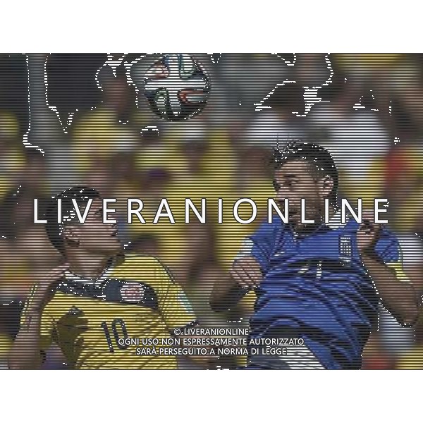 (140614) -- BELO HORIZONTE, June 14, 2014 () -- Colombia\'s James Rodriguez vies with Greek Kostas Katsouranis during a Group C match between Colombia and Greece of 2014 FIFA World Cup in the Estadio Mineirao Stadium in Belo Horizonte, Brazil, June 14, 2014. (/Qi Heng)(rh) ©PHOTOSHOT/Agenzia Aldo Liverani sas - ITALY ONLY - EDITORIAL USE ONLY - Colombia Vs Grecia partita del Gruppo C Coppa del Mondo FIFA 2014 Mineirao stadio Estadio a Belo Horizonte, in Brasile 14 Giugno 2014