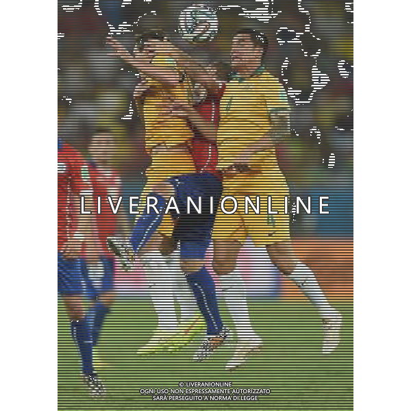 (140613) -- CUIABA, June 13, 2014 () -- Australia\'s Tim Cahill (R) competes for a headball during a Group B match between Chile and Australia of 2014 FIFA World Cup in the Arena Pantanal Stadium in Cuiaba, Brazil, June 13, 2014. Chile won 3-1 over Australia on Friday. (/Liu Dawei)(pcy) ©PHOTOSHOT/Agenzia Aldo Liverani sas - ITALY ONLY - EDITORIAL USE ONLY - Cile Vs Australia partita del Gruppo B Coppa del mondo FIFA World Cup nel Pantanal stadio Arena di Cuiaba, Brasile, 13 giugno 2014