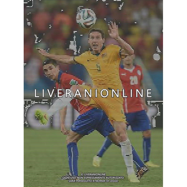 (140613) -- CUIABA, June 13, 2014 () -- Australia\'s Mark Milligan vies for the ball during a Group B match between Chile and Australia of 2014 FIFA World Cup in the Arena Pantanal Stadium in Cuiaba, Brazil, June 13, 2014. Chile won 3-1 over Australia on Friday. (/Liu Dawei)(rh) ©PHOTOSHOT/Agenzia Aldo Liverani sas - ITALY ONLY - EDITORIAL USE ONLY - Cile Vs Australia partita del Gruppo B Coppa del mondo FIFA World Cup nel Pantanal stadio Arena di Cuiaba, Brasile, 13 giugno 2014