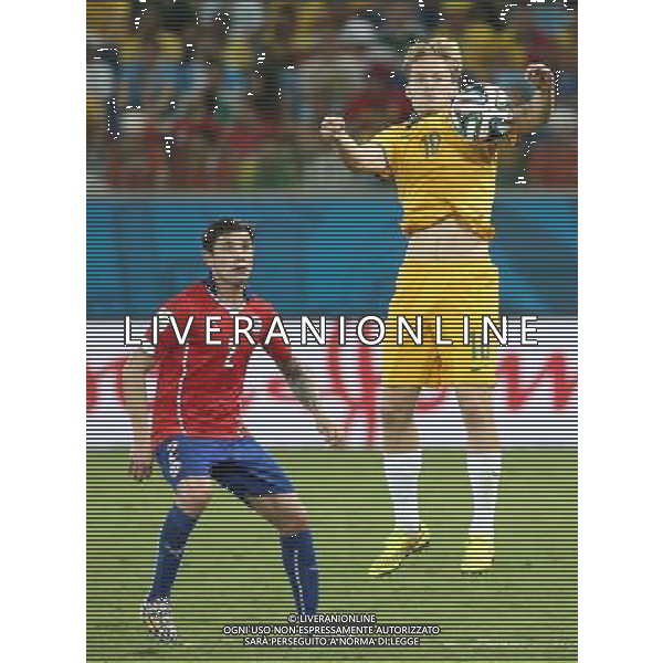 (140613) -- CUIABA, June 13, 2014 () -- Australia\'s Ben Halloran stops the ball during a Group B match between Chile and Australia of 2014 FIFA World Cup in the Arena Pantanal Stadium in Cuiaba, Brazil, June 13, 2014. Chile won 3-1 over Australia on Friday. (/Li Ming)(rh) ©PHOTOSHOT/Agenzia Aldo Liverani sas - ITALY ONLY - EDITORIAL USE ONLY - Cile Vs Australia partita del Gruppo B Coppa del mondo FIFA World Cup nel Pantanal stadio Arena di Cuiaba, Brasile, 13 giugno 2014