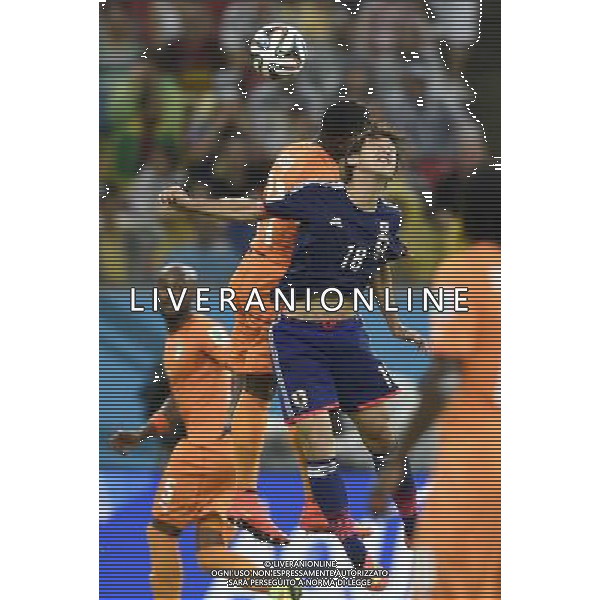 (140614) -- RECIFE, June 14, 2014 () -- Japan\'s Yuya Osako (front) competes with Cote d\'Ivoire\'s Serge Aurier for a headball during a Group C match between Cote d\'Ivoire and Japan of 2014 FIFA World Cup at the Arena Pernambuco Stadium in Recife, Brazil, June 14, 2014. (/Yang Lei)(pcy) ©PHOTOSHOT/Agenzia Aldo Liverani Sas - ITALY ONLY - EDITORIAL USE ONLY - Costa d\'Avorio Vs Giappone partita del Gruppo C della coppa del mondo 2014 FIFA World Cup Stadium Arena Pernambuco a Recife, in Brasile, 14 giugno 2014