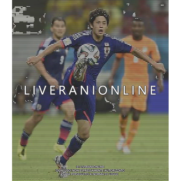 (140614) -- RECIFE, June 14, 2014 () -- Japan\'s Atsuto Uchida controls the ball during a Group C match between Cote d\'Ivoire and Japan of 2014 FIFA World Cup at the Arena Pernambuco Stadium in Recife, Brazil, June 14, 2014. (/Yang Lei)(pcy) ©PHOTOSHOT/Agenzia Aldo Liverani Sas - ITALY ONLY - EDITORIAL USE ONLY - Costa d\'Avorio Vs Giappone partita del Gruppo C della coppa del mondo 2014 FIFA World Cup Stadium Arena Pernambuco a Recife, in Brasile, 14 giugno 2014