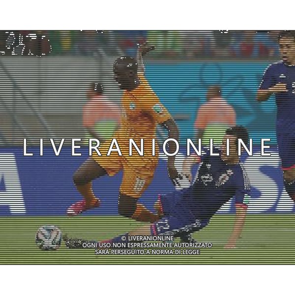 (140614) -- RECIFE, June 14, 2014 () -- Cote d\'Ivoire\'s Yaya Toure falls down during a Group C match between Cote d\'Ivoire and Japan of 2014 FIFA World Cup in the Aren Pernambuco Stadium in Recife, Brazil, June 14, 2014. (/Cao Can)(rh) ©PHOTOSHOT/Agenzia Aldo Liverani Sas - ITALY ONLY - EDITORIAL USE ONLY - Costa d\'Avorio Vs Giappone partita del Gruppo C della coppa del mondo 2014 FIFA World Cup Stadium Arena Pernambuco a Recife, in Brasile, 14 giugno 2014
