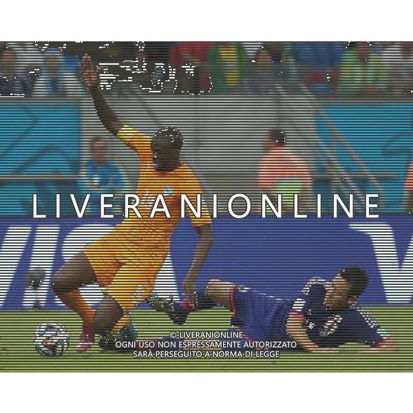 (140614) -- RECIFE, June 14, 2014 () -- Cote d\'Ivoire\'s Yaya Toure falls down during a Group C match between Cote d\'Ivoire and Japan of 2014 FIFA World Cup in the Aren Pernambuco Stadium in Recife, Brazil, June 14, 2014. (/Cao Can)(rh) ©PHOTOSHOT/Agenzia Aldo Liverani Sas - ITALY ONLY - EDITORIAL USE ONLY - Costa d\'Avorio Vs Giappone partita del Gruppo C della coppa del mondo 2014 FIFA World Cup Stadium Arena Pernambuco a Recife, in Brasile, 14 giugno 2014