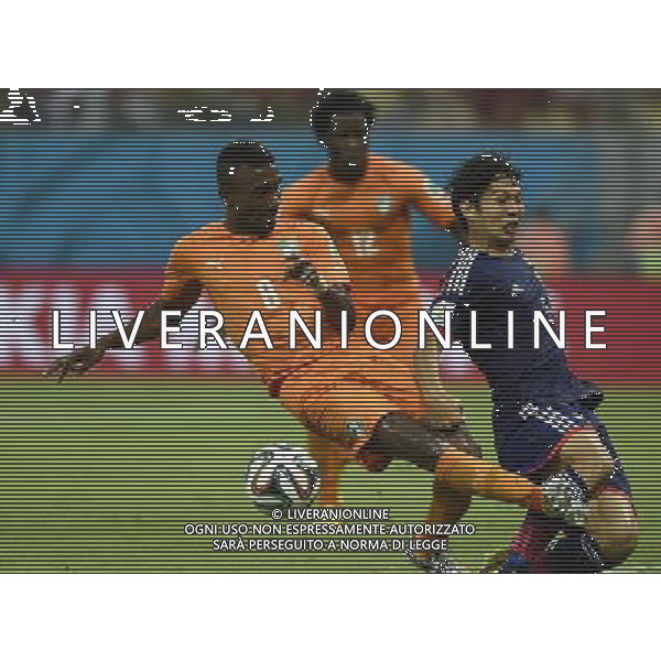 (140614) -- RECIFE, June 14, 2014 () -- Japan\'s Masato Morishige defends against Cote d\'Ivoire\'s Salomon Kalou (L) during a Group C match between Cote d\'Ivoire and Japan of 2014 FIFA World Cup at the Arena Pernambuco Stadium in Recife, Brazil, June 14, 2014. (/Yang Lei)(pcy) ©PHOTOSHOT/Agenzia Aldo Liverani Sas - ITALY ONLY - EDITORIAL USE ONLY - Costa d\'Avorio Vs Giappone partita del Gruppo C della coppa del mondo 2014 FIFA World Cup Stadium Arena Pernambuco a Recife, in Brasile, 14 giugno 2014