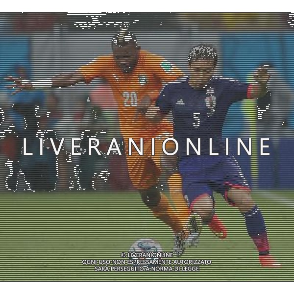 (140614) -- RECIFE, June 14, 2014 () -- Cote d\'Ivoire\'s Geoffroy Serey Die vies with Japan\'s Yuto Nagatomo during a Group C match between Cote d\'Ivoire and Japan of 2014 FIFA World Cup in the Aren Pernambuco Stadium in Recife, Brazil, June 14, 2014. (/Cao Can)(rh) ©PHOTOSHOT/Agenzia Aldo Liverani Sas - ITALY ONLY - EDITORIAL USE ONLY - Costa d\'Avorio Vs Giappone partita del Gruppo C della coppa del mondo 2014 FIFA World Cup Stadium Arena Pernambuco a Recife, in Brasile, 14 giugno 2014