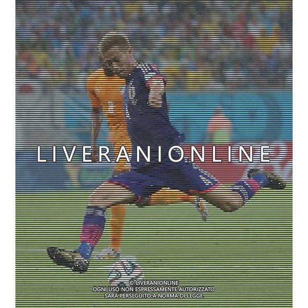 (140614) -- RECIFE, June 14, 2014 () -- Japan\'s Keisuke Honda shoots the ball during a Group C match between Cote d\'Ivoire and Japan of 2014 FIFA World Cup in the Aren Pernambuco Stadium in Recife, Brazil, June 14, 2014. (/Cao Can)(rh) ©PHOTOSHOT/Agenzia Aldo Liverani Sas - ITALY ONLY - EDITORIAL USE ONLY - Costa d\'Avorio Vs Giappone partita del Gruppo C della coppa del mondo 2014 FIFA World Cup Stadium Arena Pernambuco a Recife, in Brasile, 14 giugno 2014