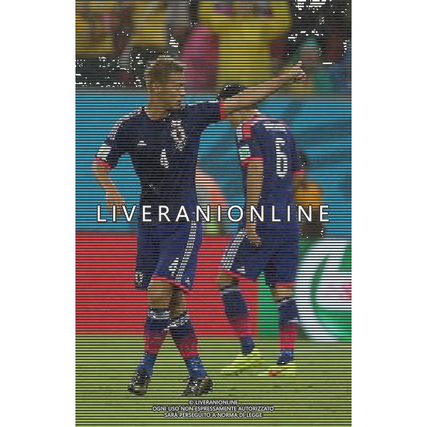 (140614) -- RECIFE, June 14, 2014 () -- Japan\'s Keisuke Honda (L) reacts during a Group C match between Cote d\'Ivoire and Japan of 2014 FIFA World Cup in the Aren Pernambuco Stadium in Recife, Brazil, June 14, 2014. (/Cao Can)(rh) ©PHOTOSHOT/Agenzia Aldo Liverani Sas - ITALY ONLY - EDITORIAL USE ONLY - Costa d\'Avorio Vs Giappone partita del Gruppo C della coppa del mondo 2014 FIFA World Cup Stadium Arena Pernambuco a Recife, in Brasile, 14 giugno 2014
