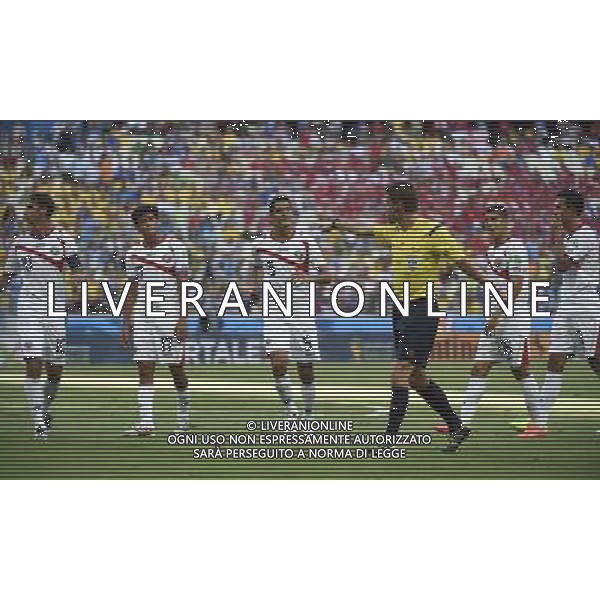 (140614) -- FORTALEZA, June 14, 2014 () -- Costa Rica\'s players react as German referee Felix Brych (front) gives a penalty kick to Uruguay during a Group D match between Uruguay and Costa Rica of 2014 FIFA World Cup at the Estadio Castelao Stadium in Fortaleza, Brazil, June 14, 2014. (/Lui Siu Wai)(pcy) ©PHOTOSHOT/Agenzia Aldo Liverani sas - ITALY ONLY - EDITORIAL USE ONLY - Uruguay vs Costa Rica partita del Gruppo D della Coppa del mondo FIFA 2014 Castelao stadio Estadio a Fortaleza, in Brasile, 14 Giugno 2014