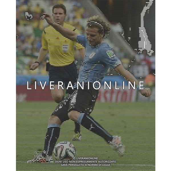 (140614) -- FORTALEZA, June 14, 2014 () -- Uruguay\'s Diego Forlan kicks the ball during a Group D match between Uruguay and Costa Rica of 2014 FIFA World Cup at the Estadio Castelao Stadium in Fortaleza, Brazil, June 14, 2014. (/Lui Siu Wai)(pcy) ©PHOTOSHOT/Agenzia Aldo Liverani sas - ITALY ONLY - EDITORIAL USE ONLY - Uruguay vs Costa Rica partita del Gruppo D della Coppa del mondo FIFA 2014 Castelao stadio Estadio a Fortaleza, in Brasile, 14 Giugno 2014