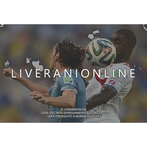 (140614) -- FORTALEZA, June 14, 2014 () -- Uruguay\'s Diego Godin competes a headball with Costa Rica\'s Joel Campbell during a Group D match between Uruguay and Costa Rica of 2014 FIFA World Cup in the Estadio Castelao Stadium in Fortaleza, Brazil, June 14, 2014. (/Guo Yong)(rh) ©PHOTOSHOT/Agenzia Aldo Liverani sas - ITALY ONLY - EDITORIAL USE ONLY - Uruguay vs Costa Rica partita del Gruppo D della Coppa del mondo FIFA 2014 Castelao stadio Estadio a Fortaleza, in Brasile, 14 Giugno 2014