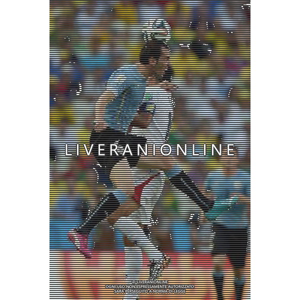 (140614) -- FORTALEZA, June 14, 2014 () -- Uruguay\'s Diego Godin competes for a headball during a Group D match between Uruguay and Costa Rica of 2014 FIFA World Cup in the Estadio Castelao Stadium in Fortaleza, Brazil, June 14, 2014. (/Guo Yong)(rh) ©PHOTOSHOT/Agenzia Aldo Liverani sas - ITALY ONLY - EDITORIAL USE ONLY - Uruguay vs Costa Rica partita del Gruppo D della Coppa del mondo FIFA 2014 Castelao stadio Estadio a Fortaleza, in Brasile, 14 Giugno 2014