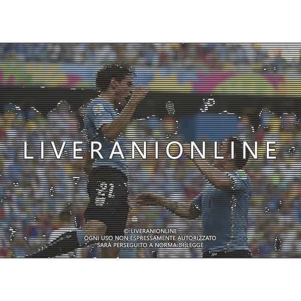 (140614) -- FORTALEZA, June 14, 2014 () -- Uruguay\'s Edinson Cavani (L) celebrates with his teammate Cristian Rodriguez for his goal of a penalty kick during a Group D match between Uruguay and Costa Rica of 2014 FIFA World Cup at the Estadio Castelao Stadium in Fortaleza, Brazil, June 14, 2014. (/Lui Siu Wai)(pcy) ©PHOTOSHOT/Agenzia Aldo Liverani sas - ITALY ONLY - EDITORIAL USE ONLY - Uruguay vs Costa Rica partita del Gruppo D della Coppa del mondo FIFA 2014 Castelao stadio Estadio a Fortaleza, in Brasile, 14 Giugno 2014