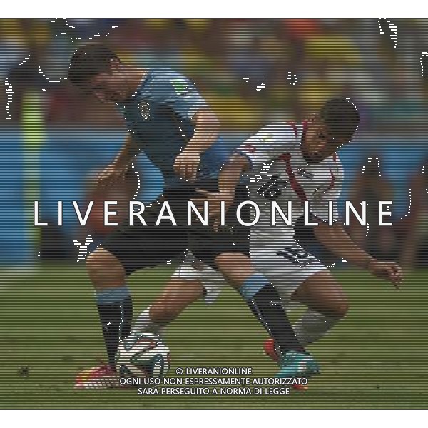 (140614) -- FORTALEZA, June 14, 2014 () -- Uruguay\'s Cristian Rodriguez vies with Costa Rica\'s Christian Gamboa during a Group D match between Uruguay and Costa Rica of 2014 FIFA World Cup in the Estadio Castelao Stadium in Fortaleza, Brazil, June 14, 2014. (/Guo Yong)(rh) ©PHOTOSHOT/Agenzia Aldo Liverani sas - ITALY ONLY - EDITORIAL USE ONLY - Uruguay vs Costa Rica partita del Gruppo D della Coppa del mondo FIFA 2014 Castelao stadio Estadio a Fortaleza, in Brasile, 14 Giugno 2014