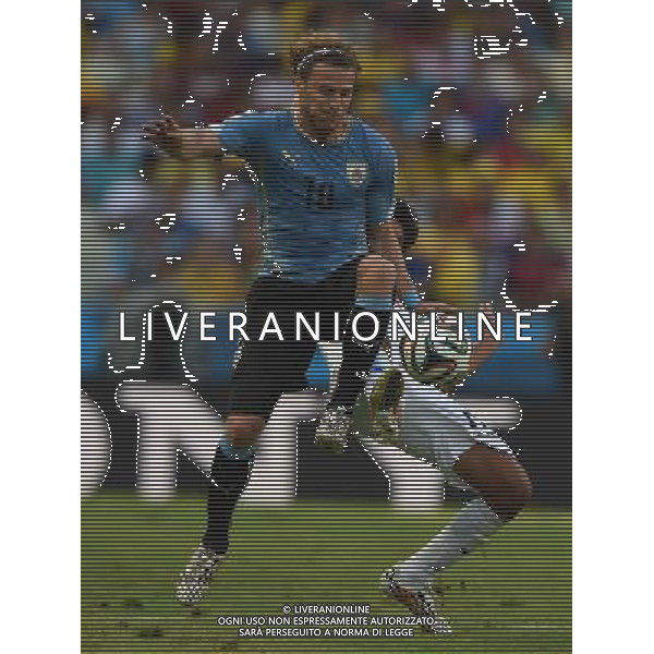 (140614) -- FORTALEZA, June 14, 2014 () -- Uruguay\'s Diego Forlan vies for the ball during a Group D match between Uruguay and Costa Rica of 2014 FIFA World Cup in the Estadio Castelao Stadium in Fortaleza, Brazil, June 14, 2014. (/Guo Yong)(rh) ©PHOTOSHOT/Agenzia Aldo Liverani sas - ITALY ONLY - EDITORIAL USE ONLY - Uruguay vs Costa Rica partita del Gruppo D della Coppa del mondo FIFA 2014 Castelao stadio Estadio a Fortaleza, in Brasile, 14 Giugno 2014