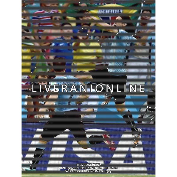 (140614) -- FORTALEZA, June 14, 2014 () -- Uruguay\'s Edinson Cavani (up) celebrates for a penalty goal during a Group D match between Uruguay and Costa Rica of 2014 FIFA World Cup in the Estadio Castelao Stadium in Fortaleza, Brazil, June 14, 2014. (/Guo Yong)(rh) ©PHOTOSHOT/Agenzia Aldo Liverani sas - ITALY ONLY - EDITORIAL USE ONLY - Uruguay vs Costa Rica partita del Gruppo D della Coppa del mondo FIFA 2014 Castelao stadio Estadio a Fortaleza, in Brasile, 14 Giugno 2014