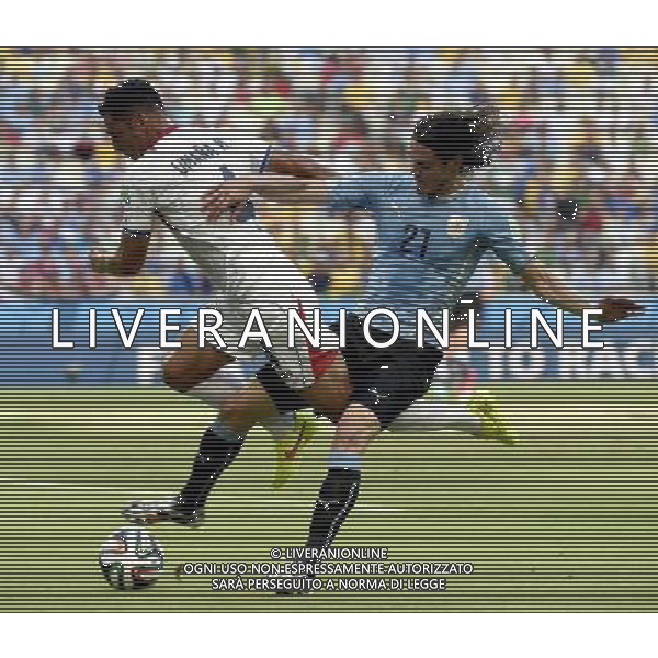(140614) -- FORTALEZA, June 14, 2014 () -- Uruguay\'s Edinson Cavani (R) competes with Costa Rica\'s Michael Umana during a Group D match between Uruguay and Costa Rica of 2014 FIFA World Cup at the Estadio Castelao Stadium in Fortaleza, Brazil, June 14, 2014. (/Lui Siu Wai)(pcy) ©PHOTOSHOT/Agenzia Aldo Liverani sas - ITALY ONLY - EDITORIAL USE ONLY - Uruguay vs Costa Rica partita del Gruppo D della Coppa del mondo FIFA 2014 Castelao stadio Estadio a Fortaleza, in Brasile, 14 Giugno 2014