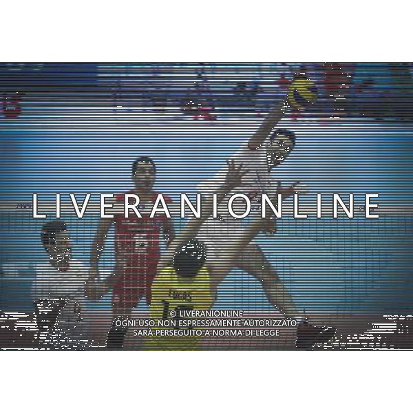 (140615) -- TEHRAN, June 15, 2014 () -- Adel Gholami (top) of Iran spikes the ball during the match against Brazil at FIVB Men\'s Volleyball World League 2014 in Tehran, capital of Iran, on June 13, 2014. Iran won 3-2. (/Ahmad Halabisaz) ©PHOTOSHOT/Agenzia Aldo Liverani sas - ITALY ONLY - EDITORIAL USE ONLY - IRAN Vs BRASILE PALLAVOLO MASCHILE FIVB VOLLEYBALL WORLD LEAGUE 2014 a Teheran 13 giugno 2014. Iran ha vinto 3-2.
