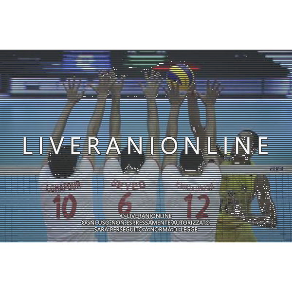 (140614) -- TEHRAN, June 14, 2014 () -- Ricardo Lucarelli (R) of Brazil spikes the ball during the match against Iran during FIVB Men\'s Volleyball World League 2014 in Tehran, capital of Iran, on June 13, 2014. Iran won 3-2. (/Ahmad Halabisaz) ©PHOTOSHOT/Agenzia Aldo Liverani sas - ITALY ONLY - EDITORIAL USE ONLY - IRAN Vs BRASILE PALLAVOLO MASCHILE FIVB VOLLEYBALL WORLD LEAGUE 2014 a Teheran 13 giugno 2014. Iran ha vinto 3-2.