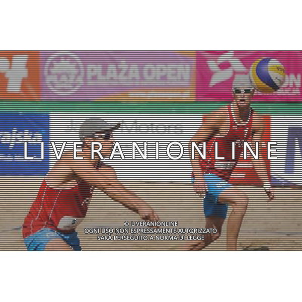 15.06.2014 , Myslowice , Slupna , siatkowka plazowa , Mistrzostwa Swiata U23 , Kosiak , Rudol (czerwone) Tvinde , Mol (niebieskie) N/Z Maciej Kosiak , Maciej Rudol Fot. Karol Bartnik / MPAimages.com / Newspix.pl --- Newspix.pl World Championships in beach volleyball U23 AG ALDO LIVERANI SAS ONLY ITALY *** Local Caption *** www.newspix.pl mail us: info@newspix.pl call us: 0048 022 23 22 222 --- Polish Picture Agency by Ringier Axel Springer Poland