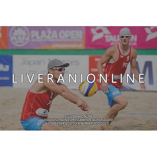 15.06.2014 , Myslowice , Slupna , siatkowka plazowa , Mistrzostwa Swiata U23 , Kosiak , Rudol (czerwone) Tvinde , Mol (niebieskie) N/Z Maciej Kosiak , Maciej Rudol Fot. Karol Bartnik / MPAimages.com / Newspix.pl --- Newspix.pl World Championships in beach volleyball U23 AG ALDO LIVERANI SAS ONLY ITALY *** Local Caption *** www.newspix.pl mail us: info@newspix.pl call us: 0048 022 23 22 222 --- Polish Picture Agency by Ringier Axel Springer Poland