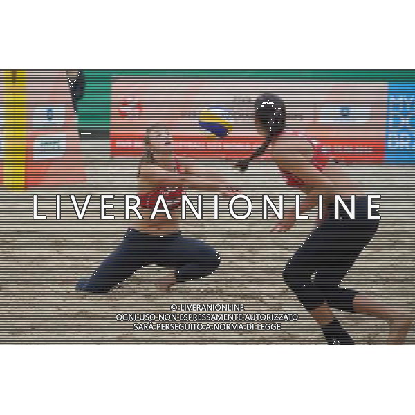 15.06.2014 , Myslowice , Slupna , siatkowka plazowa , Mistrzostwa Swiata U23 , Humana Paredes , Pischke (czerwone) Lahti , Parkkinen (niebieskie) N/Z Taylor Pischke Fot. Karol Bartnik / MPAimages.com / Newspix.pl --- Newspix.pl World Championships in beach volleyball U23 AG ALDO LIVERANI SAS ONLY ITALY *** Local Caption *** www.newspix.pl mail us: info@newspix.pl call us: 0048 022 23 22 222 --- Polish Picture Agency by Ringier Axel Springer Poland