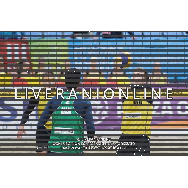 15.06.2014 , Myslowice , Slupna , siatkowka plazowa , Mistrzostwa Swiata U23 , Alliso , Guto (zielone) Poniewaz , Poniewaz (zolte) N/Z Gutavo Carvalhaes , Bennet Poniewaz Fot. Karol Bartnik / MPAimages.com / Newspix.pl --- Newspix.pl World Championships in beach volleyball U23 AG ALDO LIVERANI SAS ONLY ITALY *** Local Caption *** www.newspix.pl mail us: info@newspix.pl call us: 0048 022 23 22 222 --- Polish Picture Agency by Ringier Axel Springer Poland