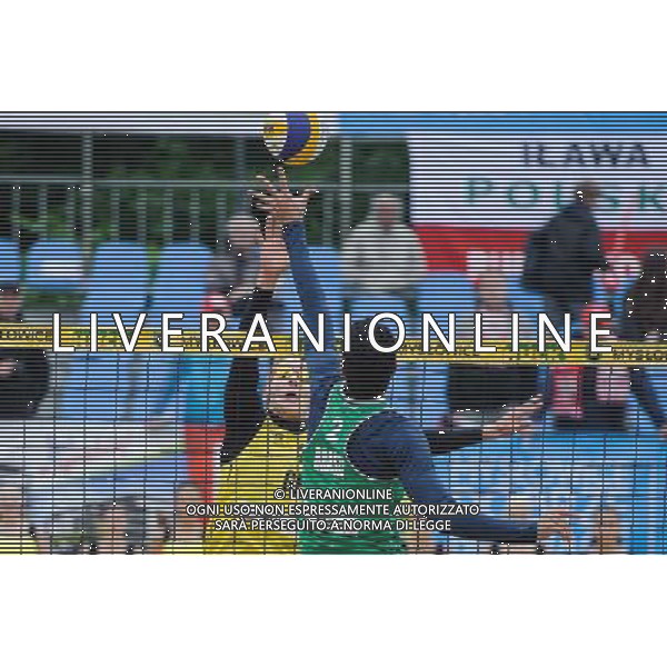 15.06.2014 , Myslowice , Slupna , siatkowka plazowa , Mistrzostwa Swiata U23 , Alliso , Guto (zielone) Poniewaz , Poniewaz (zolte) N/Z David Poniewaz , Gustavo Carvalhaes Fot. Karol Bartnik / MPAimages.com / Newspix.pl --- Newspix.pl World Championships in beach volleyball U23 AG ALDO LIVERANI SAS ONLY ITALY *** Local Caption *** www.newspix.pl mail us: info@newspix.pl call us: 0048 022 23 22 222 --- Polish Picture Agency by Ringier Axel Springer Poland