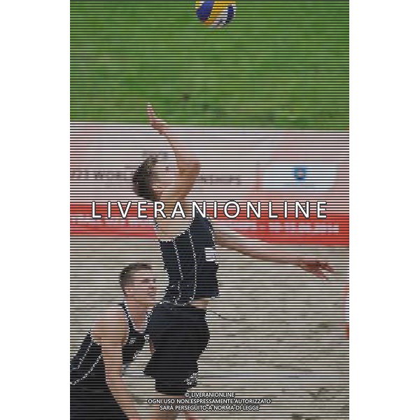 14.06.2014 , Myslowice , Slupna , siatkowka plazowa , Mistrzostwa Swiata U23 , Poniewaz , Poniewaz (czarne) Saymon , Marcus (niebieskie) N/Z Bennet Poniewaz Fot. Karol Bartnik / MPAimages.com / Newspix.pl --- Newspix.pl World Championships in beach volleyball U23 AG ALDO LIVERANI SAS ONLY ITALY *** Local Caption *** www.newspix.pl mail us: info@newspix.pl call us: 0048 022 23 22 222 --- Polish Picture Agency by Ringier Axel Springer Poland