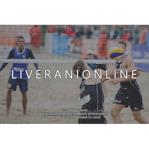 14.06.2014 , Myslowice , Slupna , siatkowka plazowa , Mistrzostwa Swiata U23 , Poniewaz , Poniewaz (czarne) Saymon , Marcus (niebieskie) N/Z Bennet Poniewaz Fot. Karol Bartnik / MPAimages.com / Newspix.pl --- Newspix.pl World Championships in beach volleyball U23 AG ALDO LIVERANI SAS ONLY ITALY *** Local Caption *** www.newspix.pl mail us: info@newspix.pl call us: 0048 022 23 22 222 --- Polish Picture Agency by Ringier Axel Springer Poland