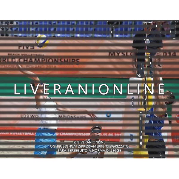 14.06.2014 , Myslowice , Slupna , siatkowka plazowa , Mistrzostwa Swiata U23 , Haralds , Armands (niebieskie) Losiak , Bryl (biale) N/Z Michal Bryl , Haralds Regza Fot. Karol Bartnik / MPAimages.com / Newspix.pl --- Newspix.pl World Championships in beach volleyball U23 AG ALDO LIVERANI SAS ONLY ITALY *** Local Caption *** www.newspix.pl mail us: info@newspix.pl call us: 0048 022 23 22 222 --- Polish Picture Agency by Ringier Axel Springer Poland