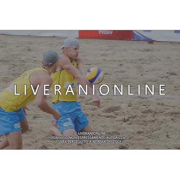 14.06.2014 , Myslowice , Slupna , siatkowka plazowa , Mistrzostwa Swiata U23 , Buivids , Reinis (czerwone) Kosiak , Rudol (zolte) N/Z Maciej Kosiak , Maciej Rudol Fot. Karol Bartnik / MPAimages.com / Newspix.pl --- Newspix.pl World Championships in beach volleyball U23 AG ALDO LIVERANI SAS ONLY ITALY *** Local Caption *** www.newspix.pl mail us: info@newspix.pl call us: 0048 022 23 22 222 --- Polish Picture Agency by Ringier Axel Springer Poland