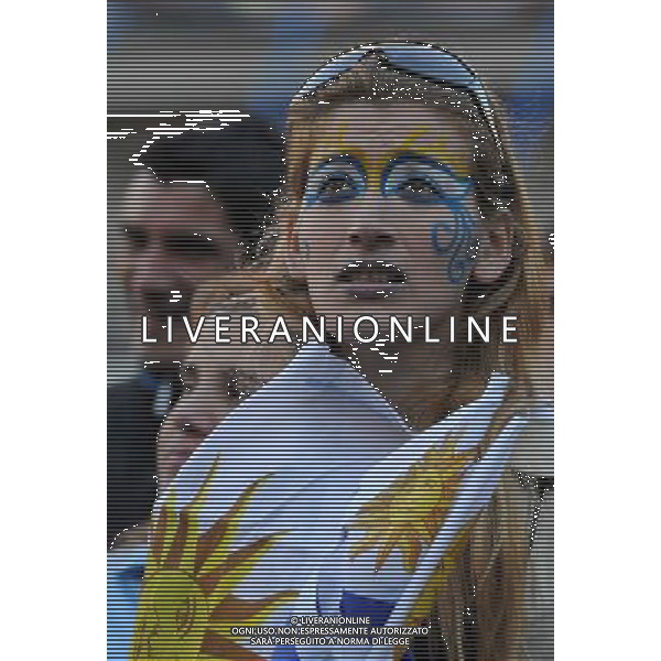 (140614) -- MONTEVIDEO, June 14, 2014 () -- An Uruguay\'s fan reacts while watching a Group D match between Uruguay and Costa Rica of 2014 FIFA World Cup on a screen in Montevideo, capital of Uruguay, on June 14, 2014. Costa Rica won 3-1 over Uruguay on Saturday.(/Nicolas Celaya)(pcy) AG ALDO LIVERANI SAS ONLY ITALY