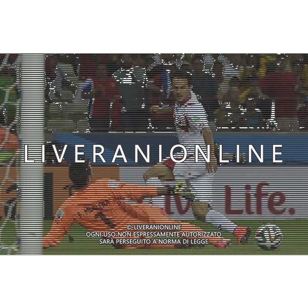 (140614) -- FORTALEZA, June 14, 2014 () -- Uruguay\'s goalkeeper Fernando Muslera (L) fails to block a shot by Costa Rica\'s Marco Urena (R) during a Group D match between Uruguay and Costa Rica of 2014 FIFA World Cup at the Estadio Castelao Stadium in Fortaleza, Brazil, June 14, 2014. Costa Rica won 3-1 over Uruguay on Saturday.(/Lui Siu Wai)(pcy) AG ALDO LIVERANI SAS ONLY ITALY