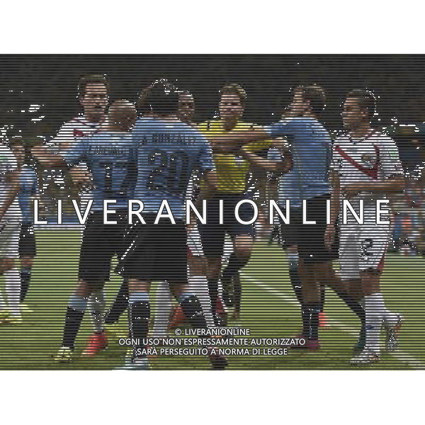 (140614) -- FORTALEZA, June 14, 2014 () -- Players react after Costa Rica\'s Joel Campbell is kicked by Uruguay\'s Maximiliano Pereira during a Group D match between Uruguay and Costa Rica of 2014 FIFA World Cup at the Estadio Castelao Stadium in Fortaleza, Brazil, June 14, 2014. Costa Rica won 3-1 over Uruguay on Saturday.(/Lui Siu Wai)(pcy) AG ALDO LIVERANI SAS ONLY ITALY