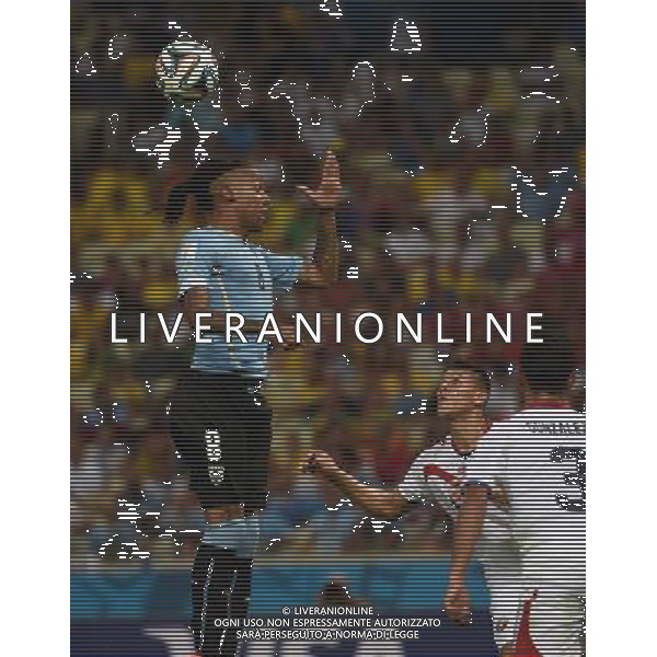 (140614) -- FORTALEZA, June 14, 2014 () -- Uruguay\'s Abel Hernandez jumps for a headball during a Group D match between Uruguay and Costa Rica of 2014 FIFA World Cup in the Estadio Castelao Stadium in Fortaleza, Brazil, June 14, 2014. (/Guo Yong)(rh) AG ALDO LIVERANI SAS ONLY ITALY